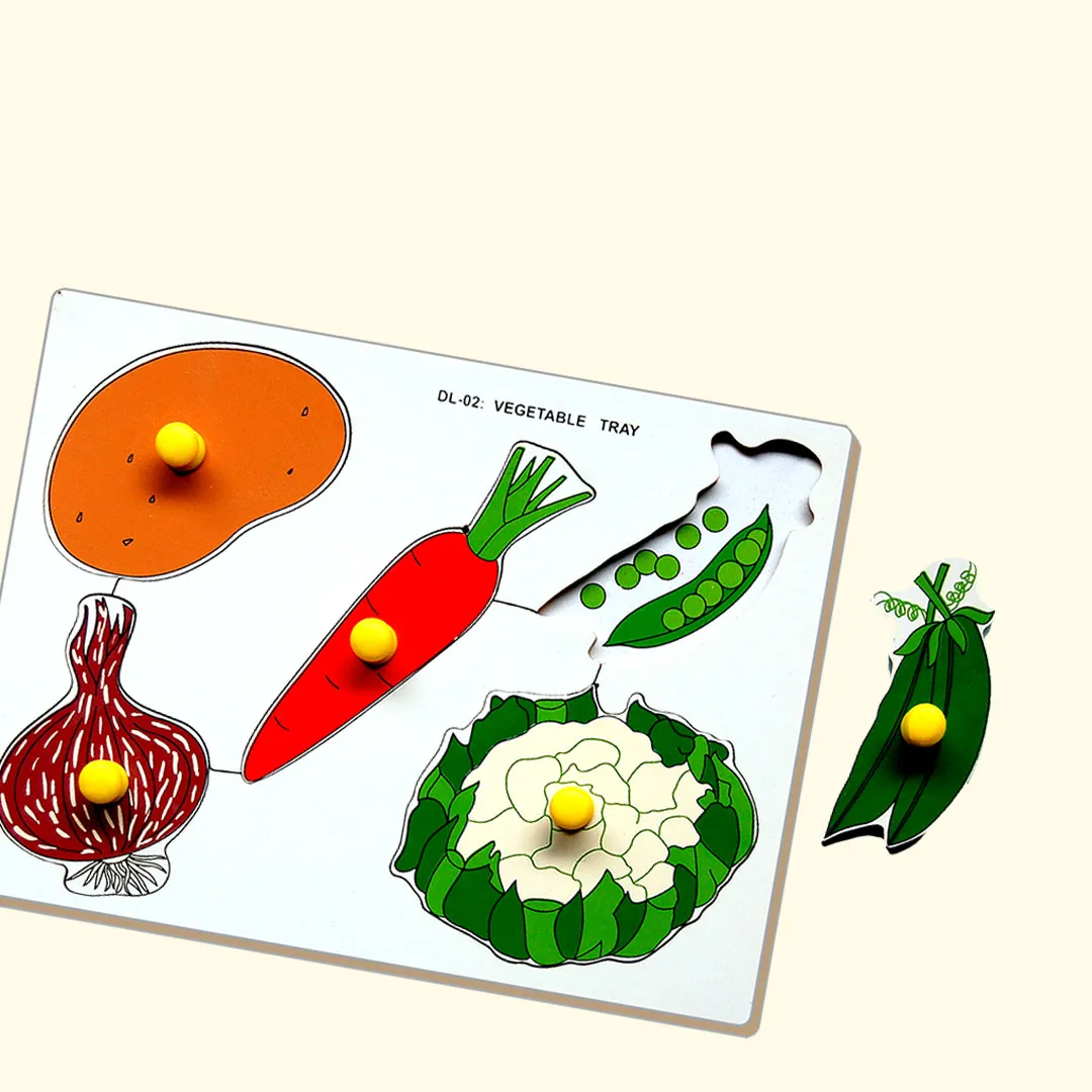 A wooden board displaying a variety of fresh vegetables, including carrots, tomatoes, and bell peppers.