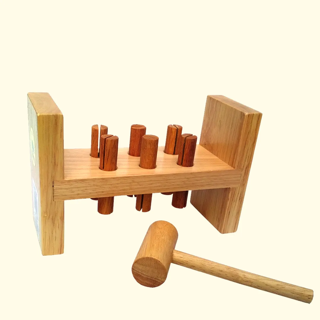 A wooden toy with sticks and a hammer, promoting fine motor skills and hand-eye coordination.