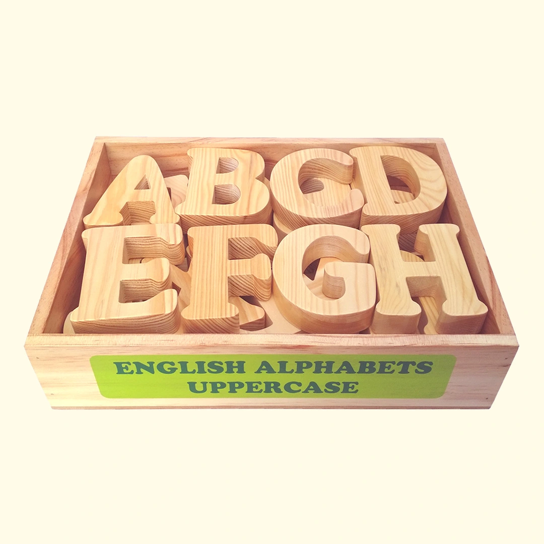 Uppercase wooden box with English alphabet letters in a wooden box.